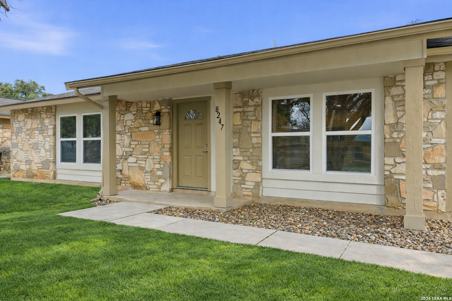 Stone entry porch detail at 8247 Lewiston St